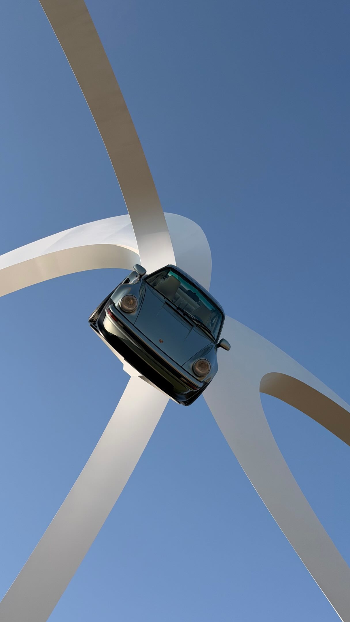 A Singer Porsche displayed beneath the Goodwood sculpture